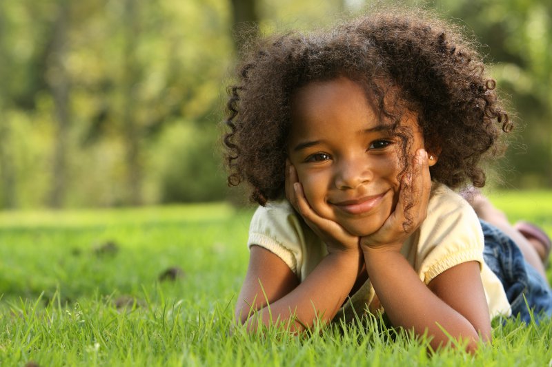 child smiling curly hair